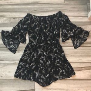 black romper with leaf-like designs